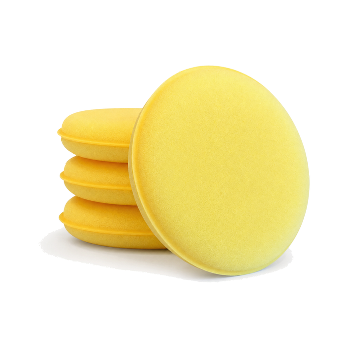 The Pro Stuff Soft Applicator Foam, four yellow 4 inch tight-cell foam pads, three stacked and one leaning