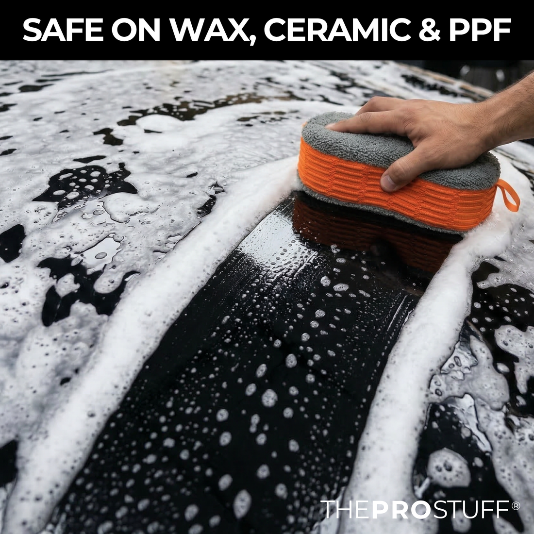 Wash mitt on a foamy black car hood, Car Wash Soap Sheets are safe on wax, ceramic and PPF