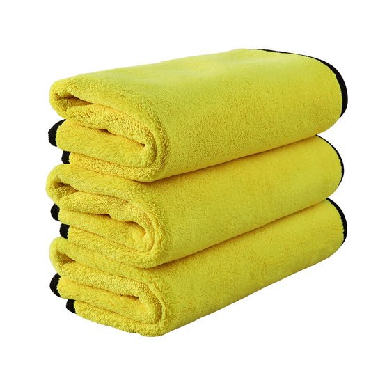 The Pro Stuff Car Detailing Microfiber, three folded yellow towels with grey reverse side