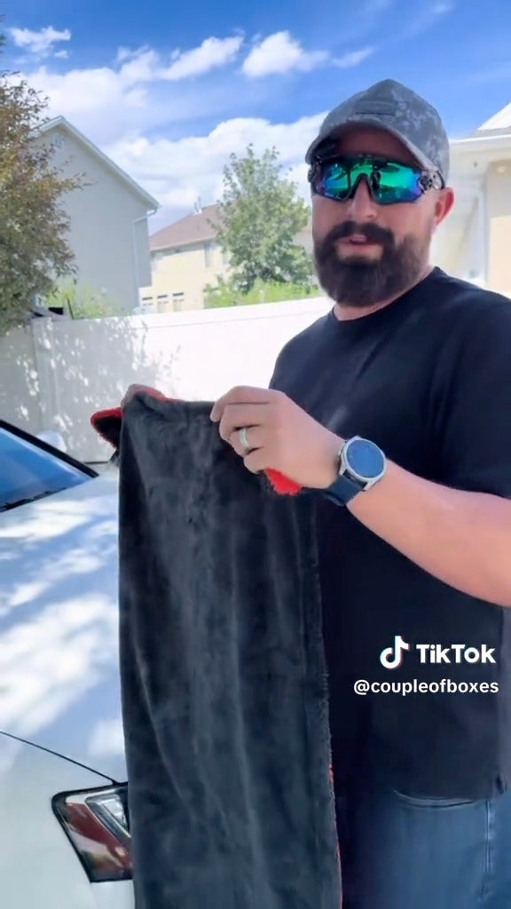 Customer holding up The Pro Stuff Car Drying Towel