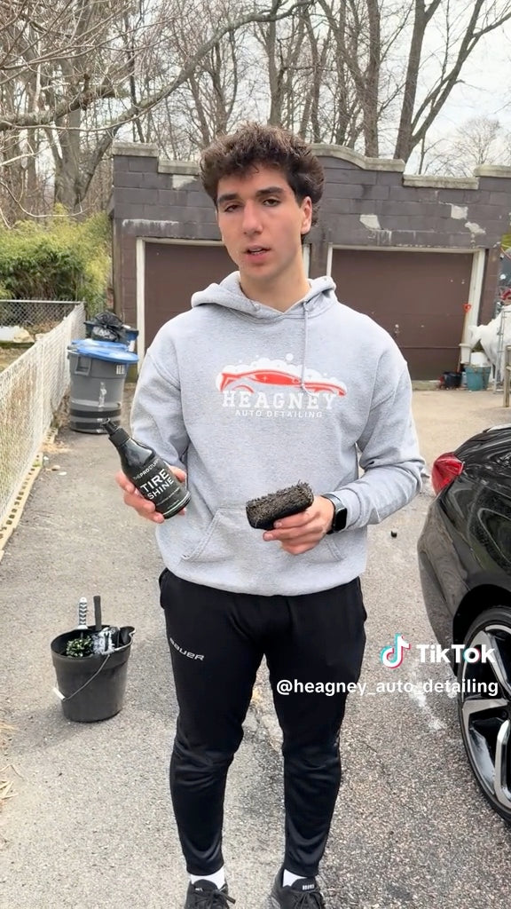 Detailer holding The Pro Stuff Tire Shine